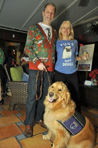 Jeff and Mason pose with a Genesis Supporter at the Ugly Sweater Party at Nick & Johnnie's