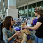 service dog and fundraiser table