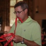 Golfer checks his raffle tickets