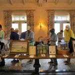 Golfers bidding on the silent auction