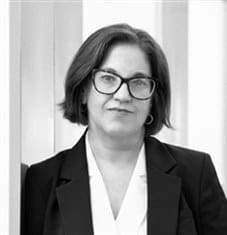 Woman in glasses with serious expression