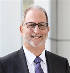 Smiling man in a suit and tie