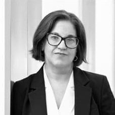 Woman in glasses with serious expression